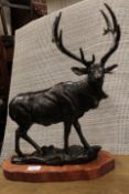 ***A CAST FIGURE OF A STAG ON A WOODEN BASE**