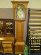 A MODERN HONEY PINE LONGCASE CLOCK WITH WEIGHTS AND PENDULUM