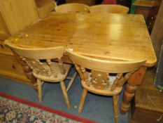 A PINE FARMHOUSE TABLE AND FOUR CHAIRS