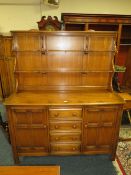 AN ERCOL DRESSER WITH RACK W-146 CM