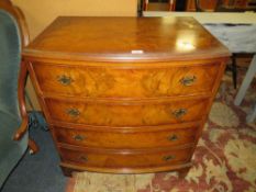 A 20TH CENTURY WALNUT BOW FRONTED FOUR DRAWER CHEST OF DRAWERS W-76 CM
