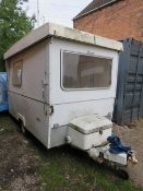 A VINTAGE MIDWAY COBUR TRAILER TENT WITH CONTENTS
