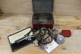 A TIN OF ASSORTED COSTUME JEWELLERY ETC