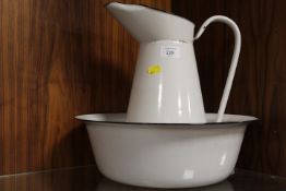 A VINTAGE ENAMEL JUG AND BOWL SET