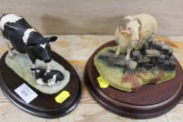 A BORDER FINE ARTS FIGURE OF A COW AND CALF TOGETHER WITH AN AYNSLEY RAM (2)