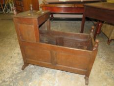 AN ANTIQUE OAK CHILDS ROCKING CRADLE - L 89 CM