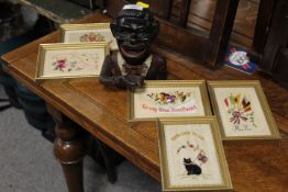 A VINTAGE HAPPY JOE MONEY BANK TOGETHER WITH FOUR FRAMED SILKS