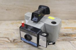 A VINTAGE SWINGER SENTINEL LAND CAMERA