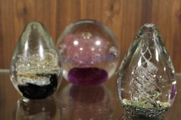 THREE VARIOUS GLASS PAPERWEIGHTS