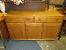 AN ERCOL TYPE SIDEBOARD ON CASTORS W-136 CM
