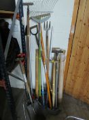 A LARGE SELECTION OF GARDEN TOOLS WITH A SET OF CHIMNEY / DRAIN RODS