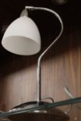 A CHROME EFFECT DESK LAMP
