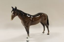 A BESWICK MODEL OF A HORSE IN BAY GLOSS FINISH