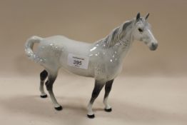 A BESWICK SWISH TAIL HORSE IN GREY GLOSS