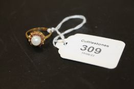 A RUBY? AND PEARL DRESS RING STAMPED 750 APPROX 5.2G