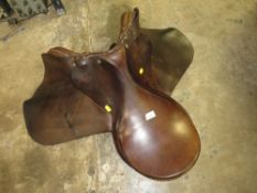 A LEATHER HORSE RIDING SADDLE