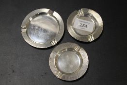 THREE HALLMARKED SILVER ASHTRAYS