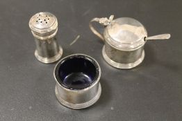 A HALLMARKED SILVER THREE PIECE CRUET SET