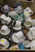 A TRAY OF ASSORTED CERAMIC COFFEE CUPS AND SAUCER TO INCLUDE WEDGWOOD , ROYAL DOULTON, ROYAL