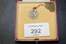 A 9CT GOLD DIAMOND SET PENDANT NECKLACE ON A 9CT CHAIN