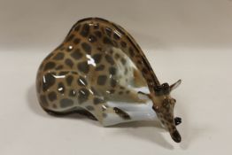 A VINTAGE RUSSIAN LOMONOSOV FIGURE OF A RESTING GIRAFFE