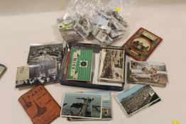 A COLLECTION OF VINTAGE POSTCARDS AND CIGARETTE CARDS