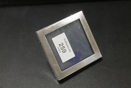 A SMALL SQUARE HALLMARKED SILVER PICTURE FRAME