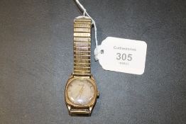 A HALLMARKED 9CT GOLD ROTARY WRIST WATCH ON EXPANDABLE STEEL BRACELET