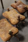 THREE VINTAGE CAMEL SADDLE STOOLS