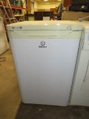 AN INDESIT UNDER COUNTER FREEZER