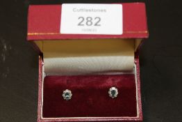 A PAIR OF 9CT GOLD, DIAMOND AND AQUAMARINE STUD EARRINGS