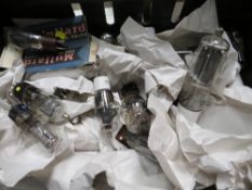A TRAY OF LARGE RADIO AND MILITARY VALVES WRAPPED IN PACKAGING PAPER