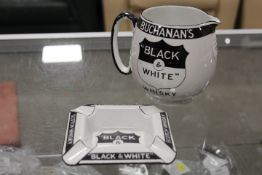A VINTAGE BLACK AND WHITE WHISKY SHIELD JUG AND MATCHING ASHTRAY