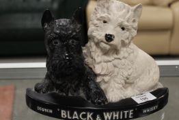 A VINTAGE BLACK AND WHITE WHISKY DOGS BAR DISPLAY