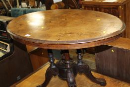 A SMALL VICTORIAN WALNUT INLAID TILT-TOP TABLE