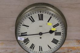A VINTAGE CIRCULAR BRASS MOUNTED WALL CLOCK