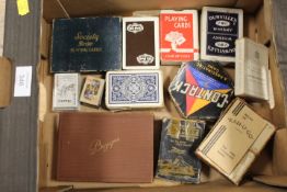 A SMALL TRAY OF ASSORTED PLAYING CARD SETS