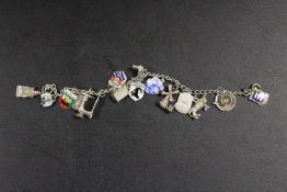 A VINTAGE SILVER CHARM BRACELET