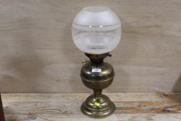 A BRASS OIL LAMP WITH BRASS ETCHED SHADE