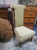 AN ANTIQUE MAHOGANY FRAMED PRAYER CHAIR