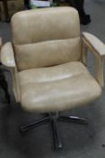 A RETRO SWIVEL ARMCHAIR