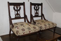 A PAIR OF EDWARDIAN MAHOGANY CARVED CHILDS CHAIRS
