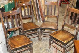 A SET OF FOUR TRADITIONAL ELM CHAIRS