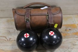 A CASED SET OF LAWN BOWLS