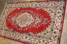 A VINTAGE NORTHERN INDIAN WOOLLEN RUG FROM JAIPUR - APPROX 160 x 90 cm