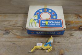 A VINTAGE PLASTIC BABYCHAM ADVERTISING DEER TOGETHER WITH A SET OF SIX BABYCHAM GLASSES IN AN