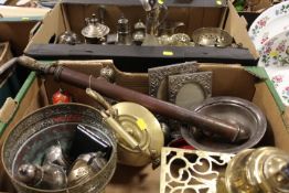 TWO TRAYS OF ASSORTED SILVER-PLATED METAL WARE TO INCLUDE A SHIPS DECANTER, BRASS TRIVET ETC