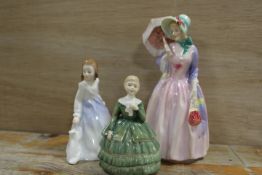 A ROYAL DOULTON FIGURINE