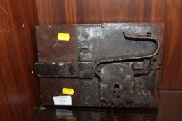 AN EARLY LOCK SET ON A WOODEN PANEL