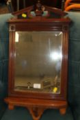 AN EDWARDIAN MAHOGANY MIRROR BRACKET